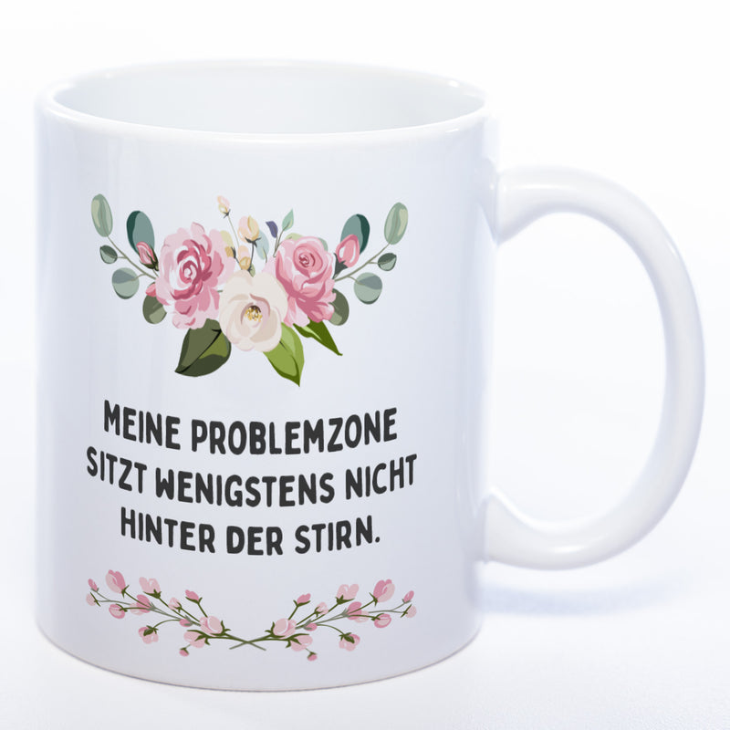 Blümchen-Tasse mit Spruch "Meine Problemzone sitzt wenigstens nicht hinter der Stirn." - Lustige Kaffeetasse spülmaschinenfest