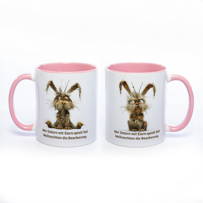 Motiv - Tasse mit Spruch und Hase: Wer Ostern mit Eiern spielt hat Weihnachten die Bescherung.- spülmaschinenfest