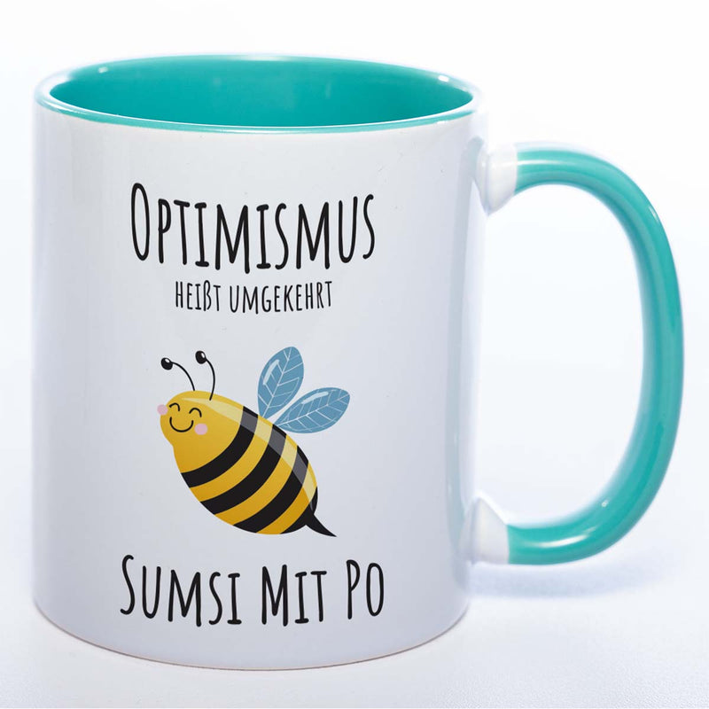 Lustige Tasse „Optimismus – Sumsi mit Po“